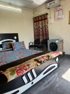 a bedroom with a large bed in a room at Apna Farmhouse - Private Villa with Pool & Play area - Near Fort -15 min to Ellora Caves in Daulatābād