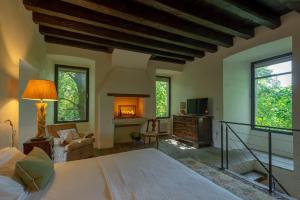 a bedroom with a large bed and a fireplace at Massimago Wine Tower in Padova