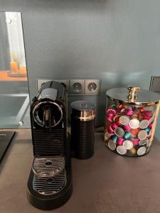 a coffee maker sitting on a counter next to a container at InkBlue-Apartment in Heidenau