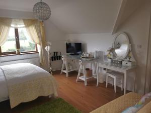 Postel nebo postele na pokoji v ubytování Cherrytree House B&B