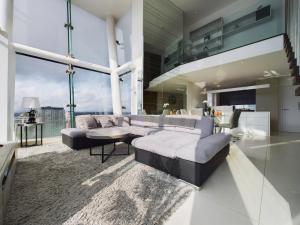 a living room with a couch and a table at Amazing Skyline Views 3BR Duplex in Manchester