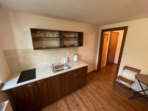 a kitchen with a sink and a counter top at VLADIMÍR, rekreační středisko in Šternberk