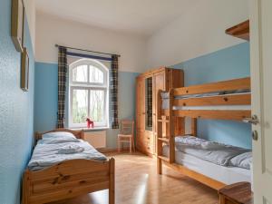 Ένα ή περισσότερα κρεβάτια σε δωμάτιο στο Ferienhof Augustenhöhe