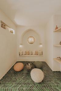 a room with two circular stools on the floor at Riad Casa Kasbah in Marrakech