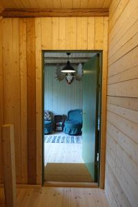 a room with a mirror and a room with a bedroom at Attic apartment on countryside in Mörarp