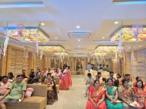 a group of people sitting in a room at Country Green Hotel & Banquet in Bareilly