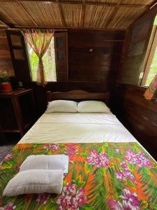 Posteľ alebo postele v izbe v ubytovaní Casa da mata marajó
