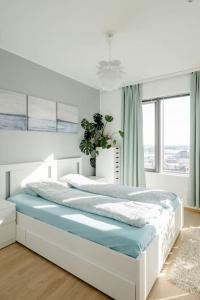 Postel nebo postele na pokoji v ubytování Fabulous Morden Apartment in Helsinki