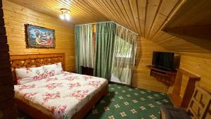 Postel nebo postele na pokoji v ubytování Complex Țurcana Transalpina