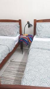 سرير أو أسرّة في غرفة في Butterworth homey House (3R2B + carpark)