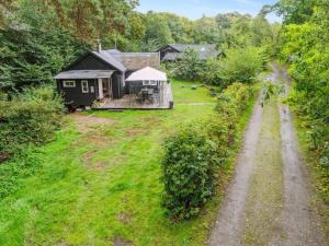 an aerial view of a yard with a house at Holiday Home Lucie - 50m from the sea in Bornholm by Interhome in Rønne