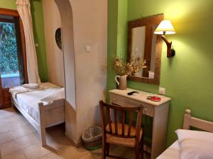 Postel nebo postele na pokoji v ubytování Skourgias Rooms