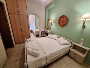 Postel nebo postele na pokoji v ubytování Skourgias Rooms