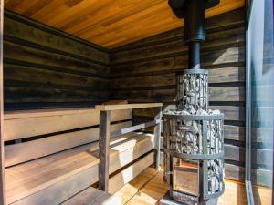 a wood burning stove in a sauna at Holiday Home Maya e Stella by Interhome in Bagni di Lucca
