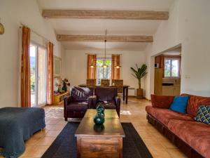 a living room with couches and a coffee table at Holiday Home Villa 10 by Interhome in Nans-les-Pins