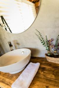 a bathroom with a white sink and a mirror at Fagoaga dorretxea in Ergoyen