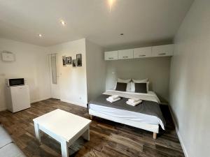 Ένα ή περισσότερα κρεβάτια σε δωμάτιο στο *Studio 1* Avenue Baudin - DABNB