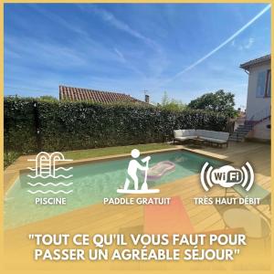 a sign for a house with a person in a swimming pool at T2 au calme - Stationnement facile - Proche gare in Toulon