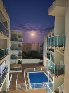 a view of an apartment building with a swimming pool at Apartamento vacacional in Torreblanca