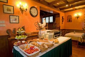 a table with bread and other food on it at Hotel Avenida Benasque in Benasque