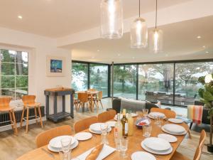 a dining room with a table and chairs at Landmark in Salcombe