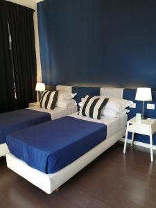 A bed or beds in a room at I DIOSCURI