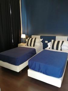 A bed or beds in a room at I DIOSCURI