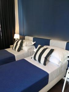 A bed or beds in a room at I DIOSCURI