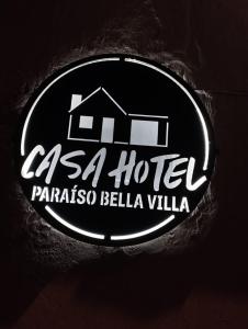 aa hotel sign with a house on it at Casa Hotel Paraíso Bella Villa in Villa de Leyva