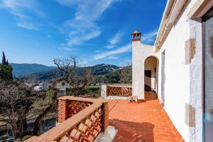 a view from the balcony of a house at NEW Can Blanch 16th Century Masía Pool Chapel in Argentona