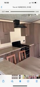 a picture of a kitchen with a stove top oven at 33 millennium gardens in Whitley Bay