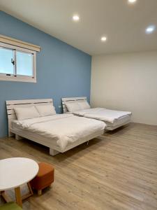 Postel nebo postele na pokoji v ubytování 山有巷宅 Alley House