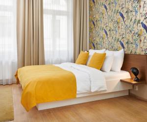 Posteľ alebo postele v izbe v ubytovaní City Nest Apartments by Adrez