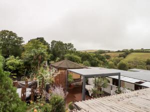 a house with a garden and a roof at Hazeldene Stables in Exeter