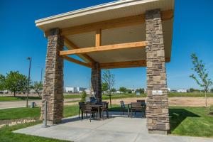a pavilion with tables and chairs in a park at My Place Hotel-Boise-Nampa, ID-Idaho Center in Nampa