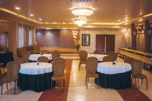 a conference room with tables and chairs in it at KRC Annexe Tezpur in Tezpur
