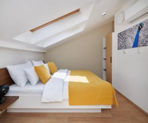 Posteľ alebo postele v izbe v ubytovaní City Nest Apartments by Adrez