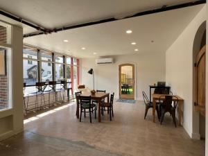 a dining room with a table and chairs at Dolores Bike Hostel in Dolores