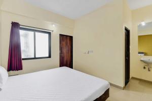 Postel nebo postele na pokoji v ubytování SPOT ON Hotel Sai Balaji