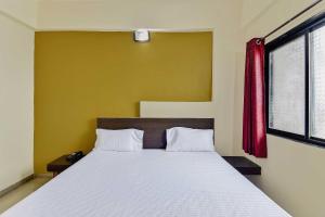 Postel nebo postele na pokoji v ubytování SPOT ON Hotel Sai Balaji