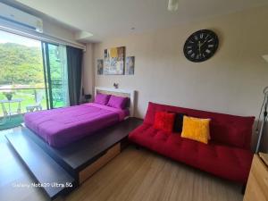 Posezení v ubytování The Naithorn Condo Unit 401 + 37 fotografií