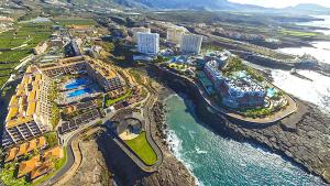 an aerial view of a resort next to the ocean at Tropicalidays Paraiso del Sur in Adeje
