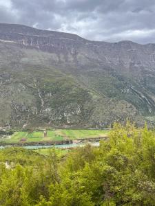 a view of a valley with a mountain in the background at Goni Guest House in Tepelenë
