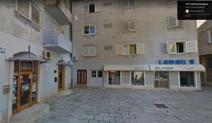 an empty street in front of a building at APARTMENT KAYA in Zadar