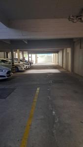 an empty parking garage with cars parked in it at Luminoso departamento céntrico in Corrientes