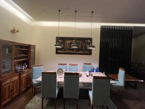 a dining room with a table and chairs at Luxury Penthouse with Taj Mahal view in Agra