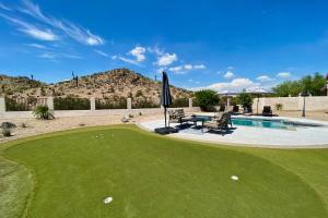 a golf course with a putting green and a pool at Desert Canyon Retreat W Heated Pool & Desert View in Phoenix