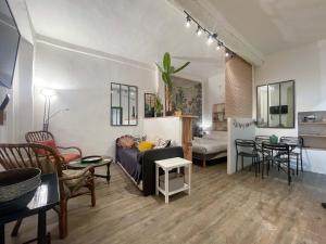 a living room with a couch and a table at Modern Apartment Nice Old Town in Nice