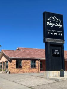 a sign for a ski lodge in front of a building at Abajo Lodge in Monticello