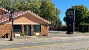 a building with a sign on the side of a street at Abajo Lodge in Monticello